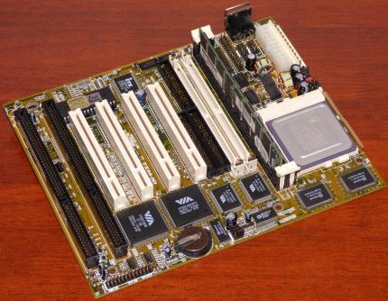 TX98 3D Rev. 1.20 Tomato Mainboard VIA VT82C585VPX 586B Chipsatz Sockel 7, 4x PCI 2x ISA PN: 00-TX98-2055-P0 AT & ATX, AMD K6-2 300MHz CPU, 128MB SDRAM, AmiBios 1995